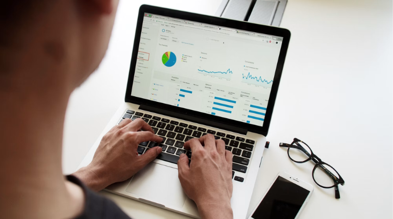 Data analytics consulting services team reviewing business dashboard